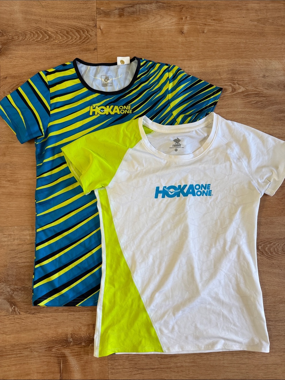 Hoka One One Women’s Black Jacket with Blue & Yellow Striped Top - Picture 2 of 5
